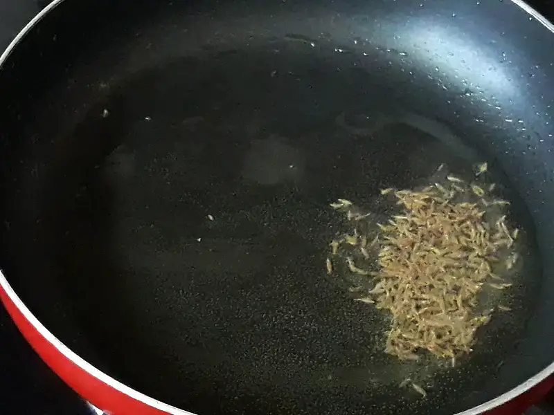 frying jeera in oil