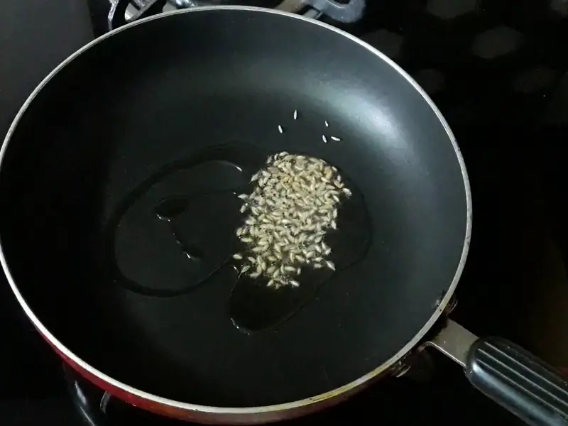 cumin seeds in hot oil for onion raita
