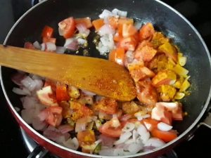 add turmeric powder, red chili powder in upma