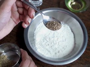 add salt and ajwain in maida