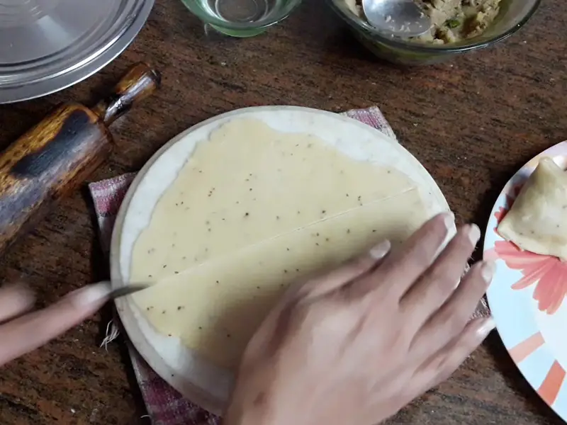 cut the maida roti from the half for folding samosa