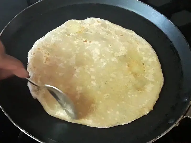 oil applied on one side of paratha