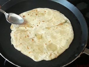 oil applied on another side of paratha