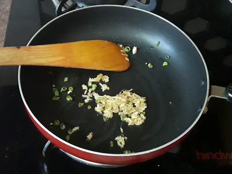 green chilies and grated ginger in the pan