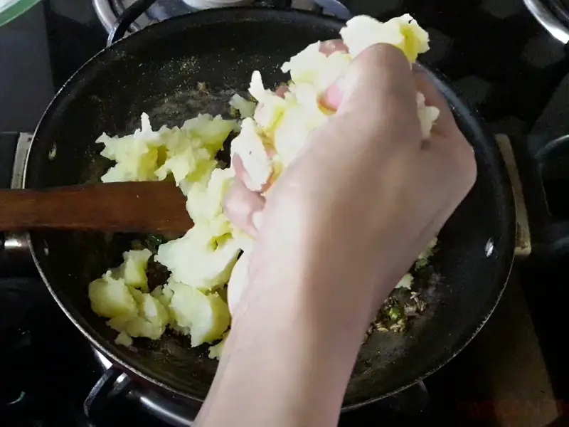 add mashed potatoes in the cooked spices