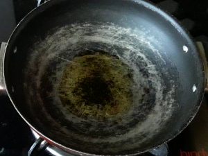 add oil in kadai for making samosa stuffing