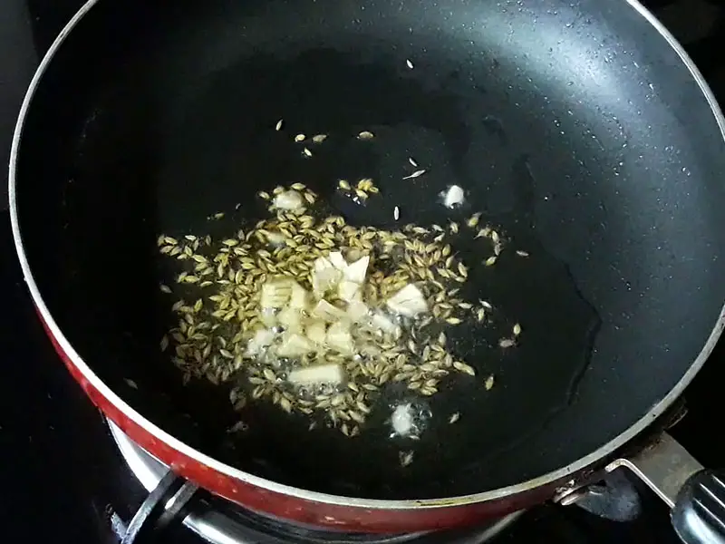 chopped ginger frying in pan