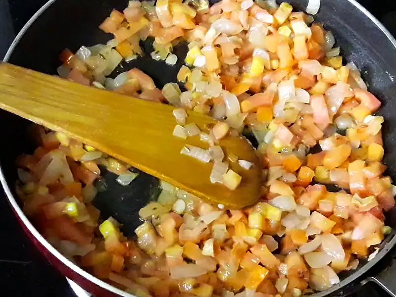 chopped tomato frying