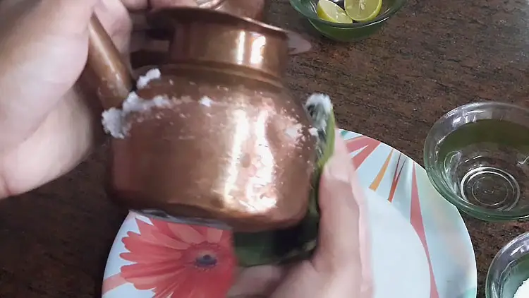 rubbing salt on copper vessel